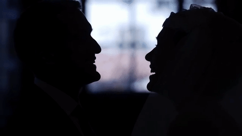 We are either bowing our heads reverently to each other in a loving moment before our ceremony ... or each furtively testing how flattering our silhouetted profiles would look if they put us on a "48 Hours Mystery" and garbled our voice/kept our identity in shadow because we were confidential informants in a highly deadly murder case. 